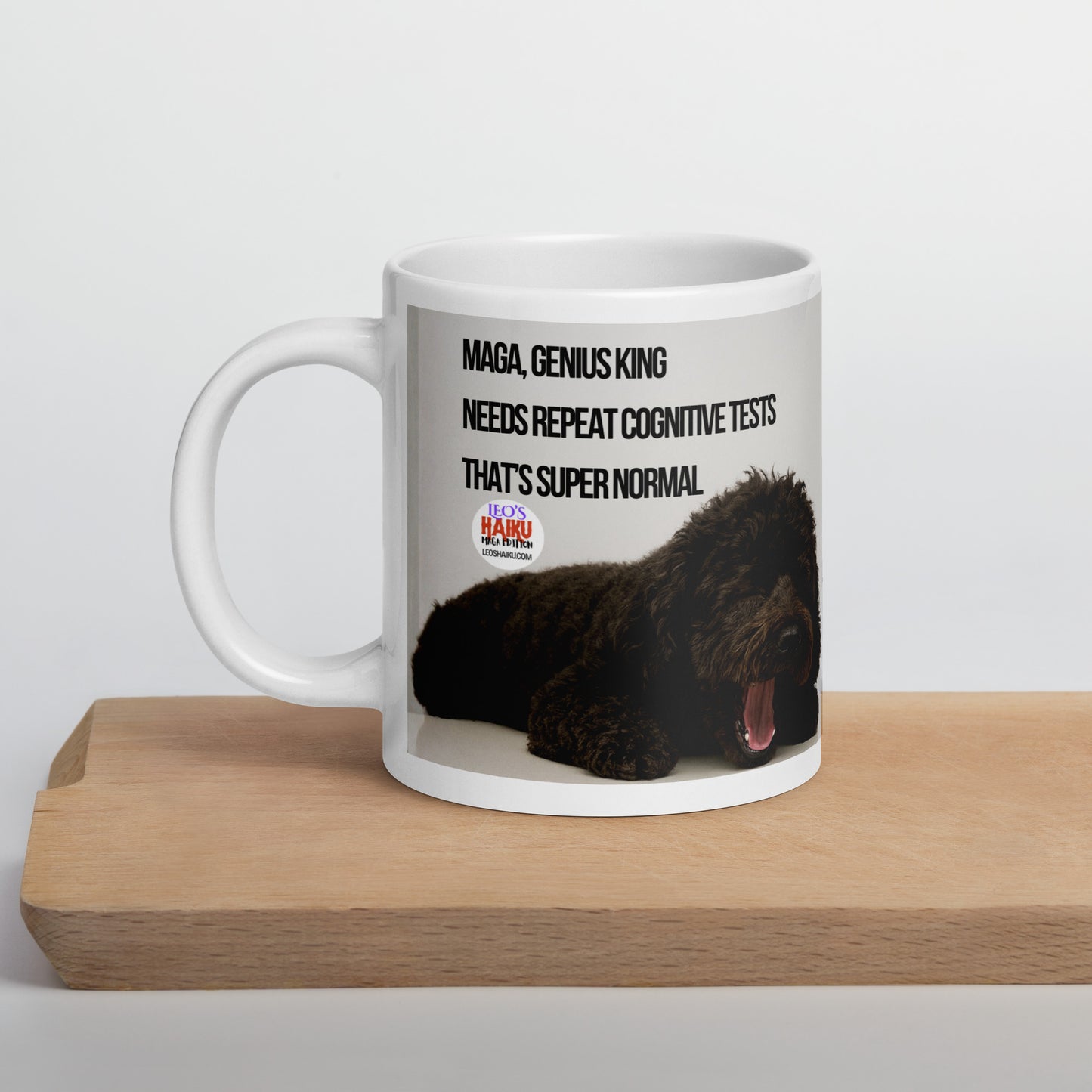 Glossy white mug with the image of a black dog sleeping with his mouth open. Political, satirical, anti-MAGA haiku is displayed as is the text logo for leoshaiku.com