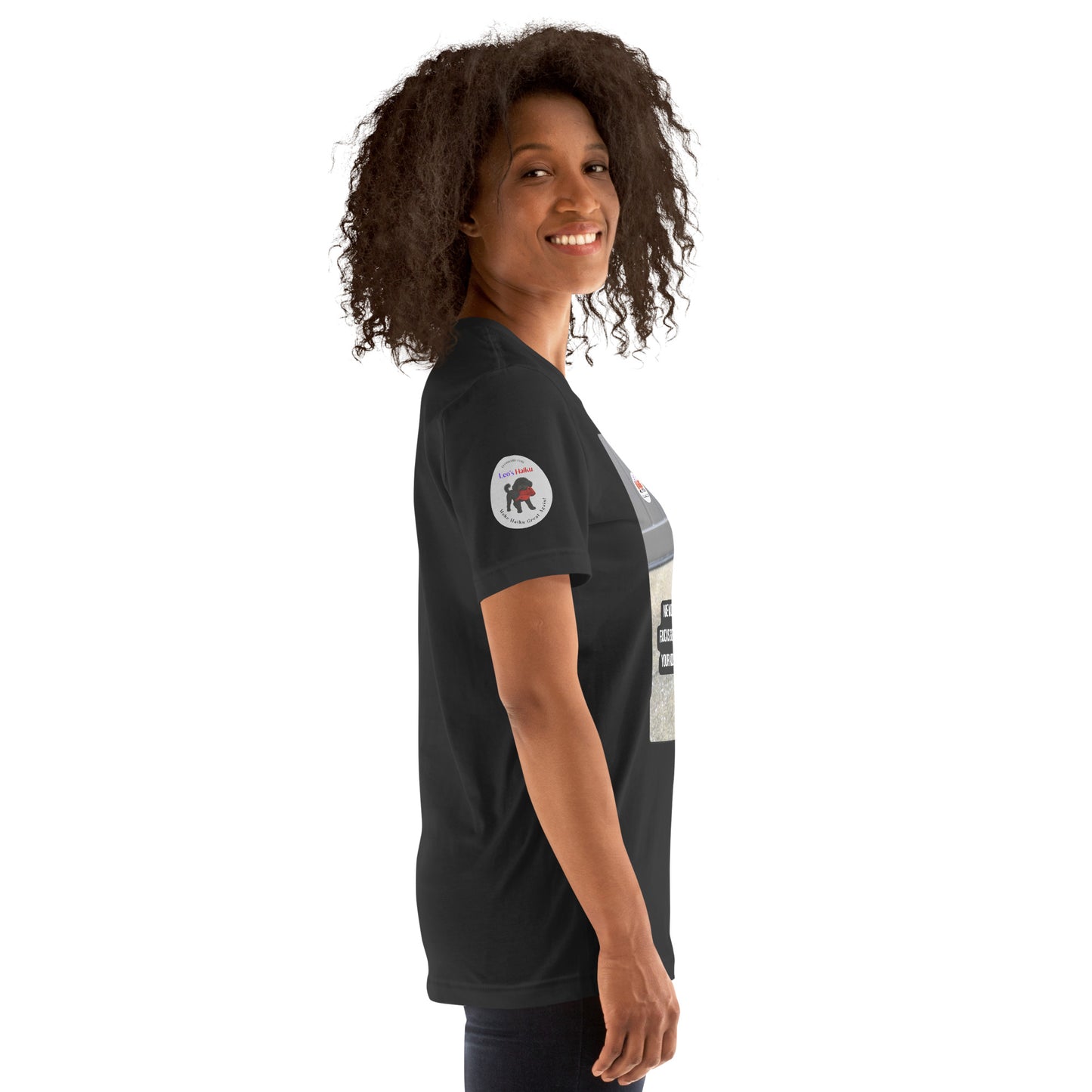 Right side view of a woman wearing a dark gray t-shirt with the logo for Leo's Haiku on the right sleeve.