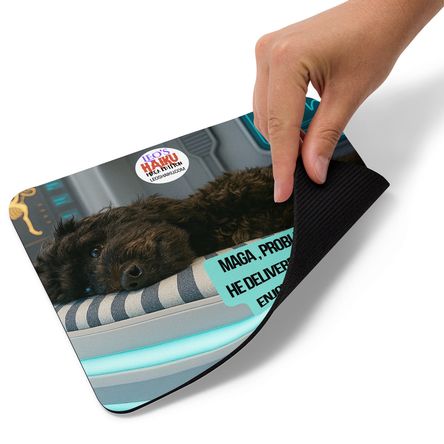 A hand lifts lower right edge of standard mouse pad printed with image of a dog lying on his side on a high tech med bed in a hospital/laboratory setting. Political, satirical, anti-MAGA haiku reads:
MAGA, Problems Solved
He Delivered, as Promised
Enjoy Your Med Bed!
This view shows the thickness of the pad.