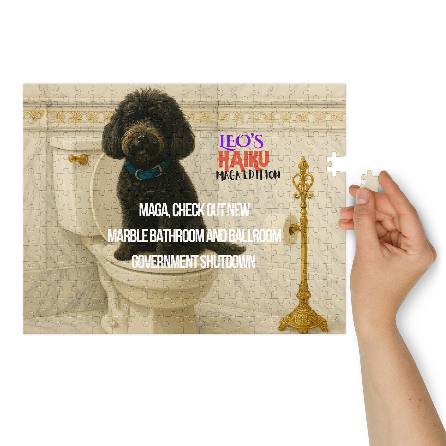 A glossy 252-piect jigsaw puzzle printed with a black dog sitting on a toilet seat in a very ornate marble and gold bathroom. Text is political satire in haiku format; branding included. At the right of the image, a woman's hand hold the last piece of the puzzle