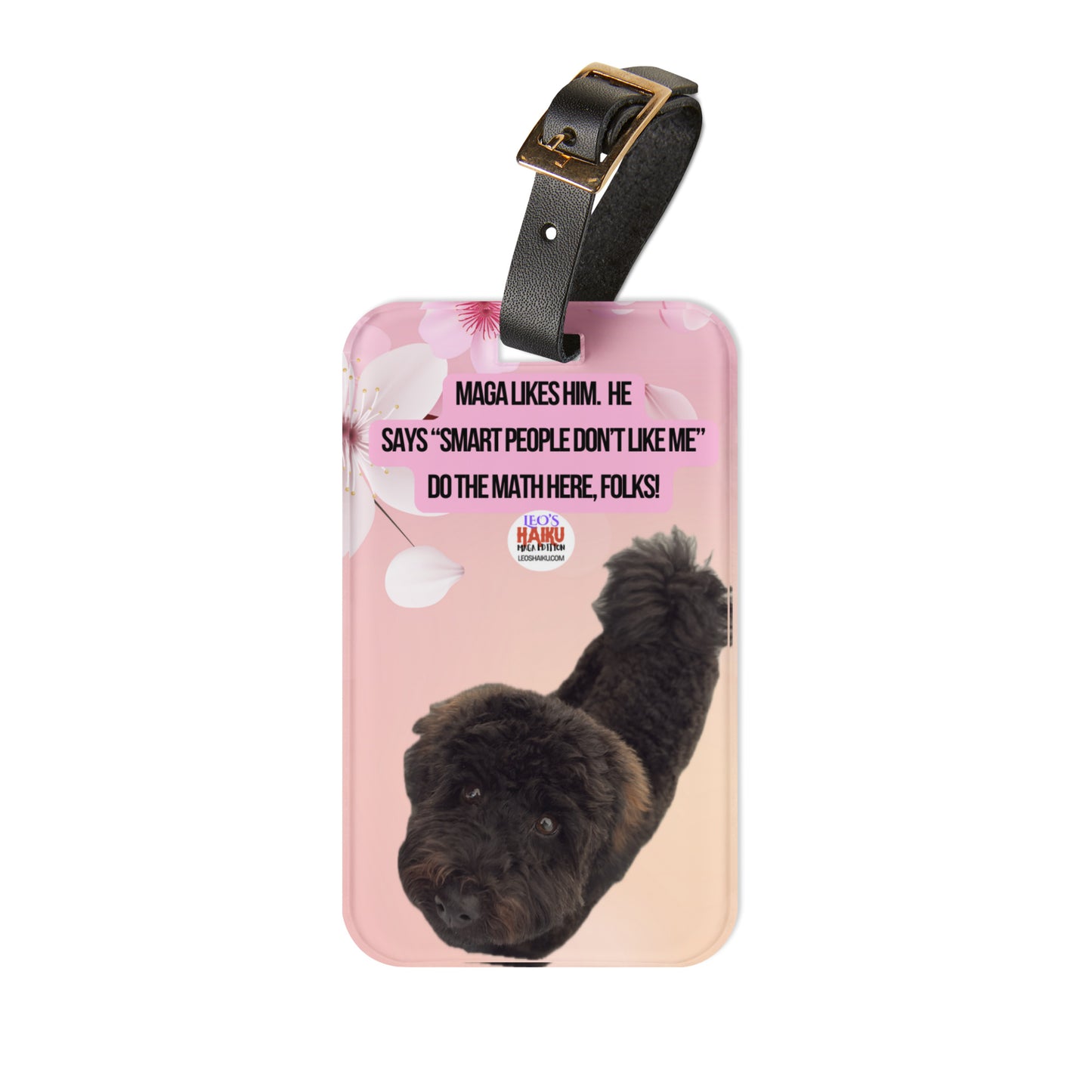 Luggage Tag with leather strap printed with the image of a black dog looking up into the camera. Centered top a political, satirical, anti-MAGA haiku reads MAGA Likes Him. He
Says "Smart People Don't Like Me."
Do the Math Here Folks!