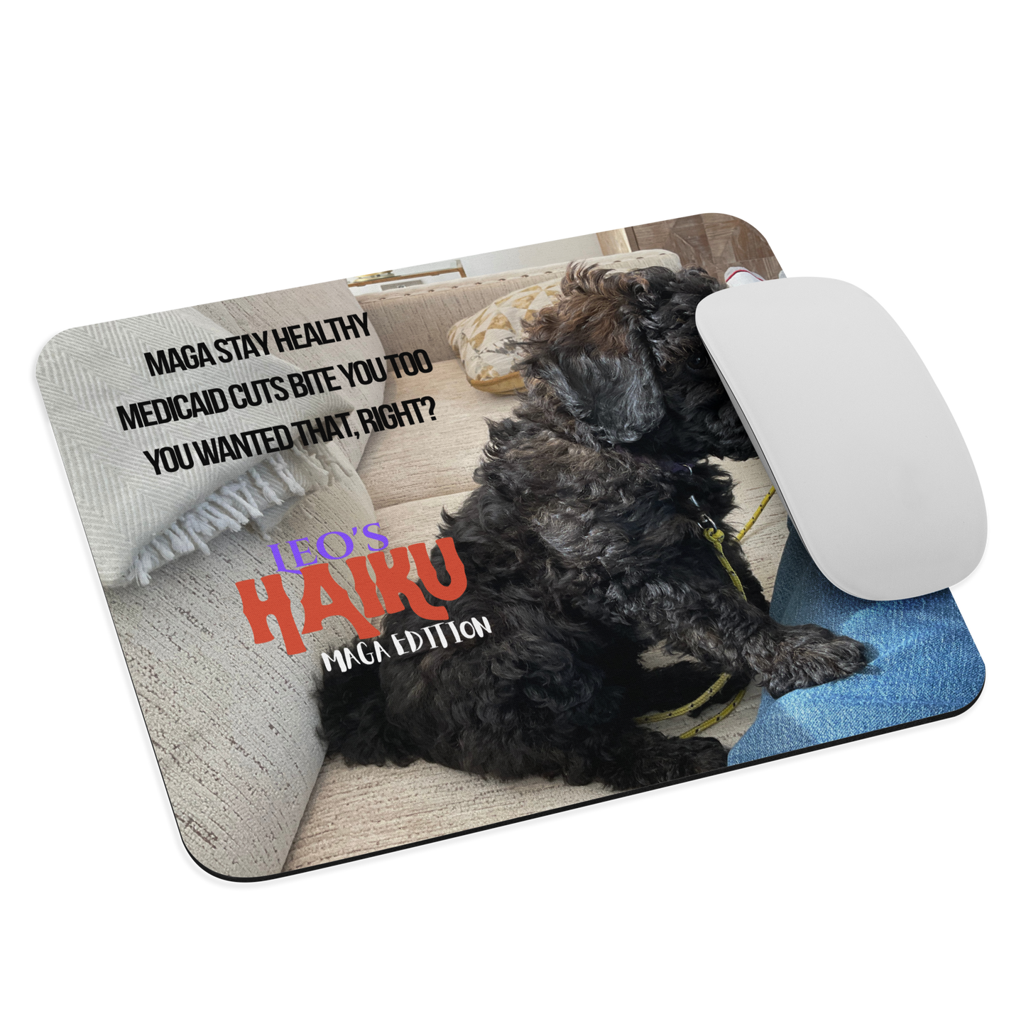 Standard-sized mouse pad printed with the side view of a poodle sitting on a beige couch, political satire in Haiku format, and branding elements. A computer mouse sits on the right side of the pad.