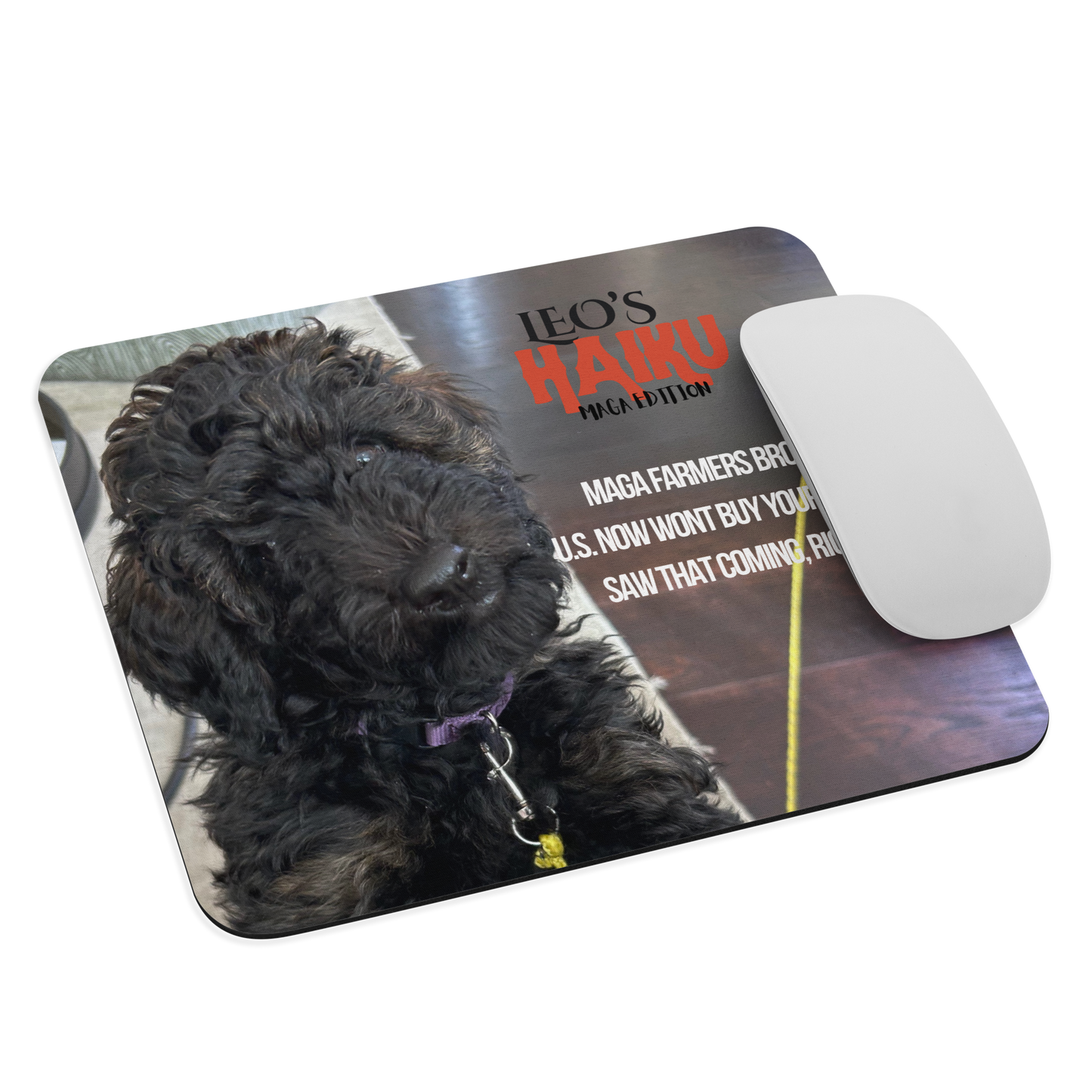 Standard-sized mouse pad printed with a dog against a dark background and political satire in Haiku format. A computer mouse sits on the right side.