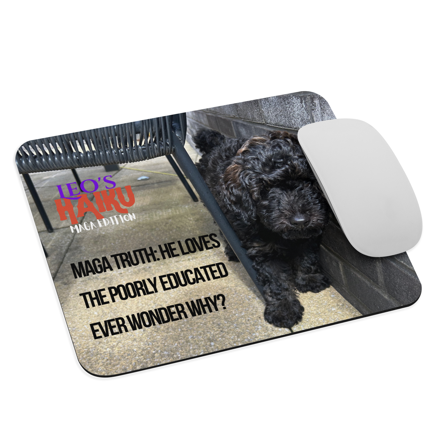 Standard-sized mouse pad printed with a dog and political satire in Haiku format. A computer mouse sits on the right side of the pad.