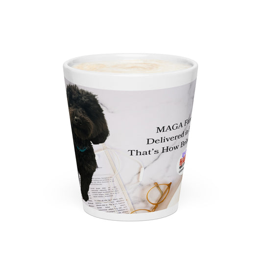 White glossy ceramic mug printed with image of a kitchen counter with a back dog sitting on a newspaper and glasses.  Political, satirical, anti-MAGA haiku is partially visible as is the text logo for leoshaiku.com