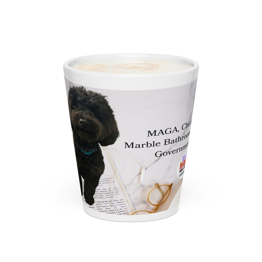 White glossy ceramic mug printed with image of a kitchen counter with a back dog sitting on a newspaper and glasses.  Political, satirical, anti-MAGA haiku is partially visible as is the text logo for leoshaiku.com