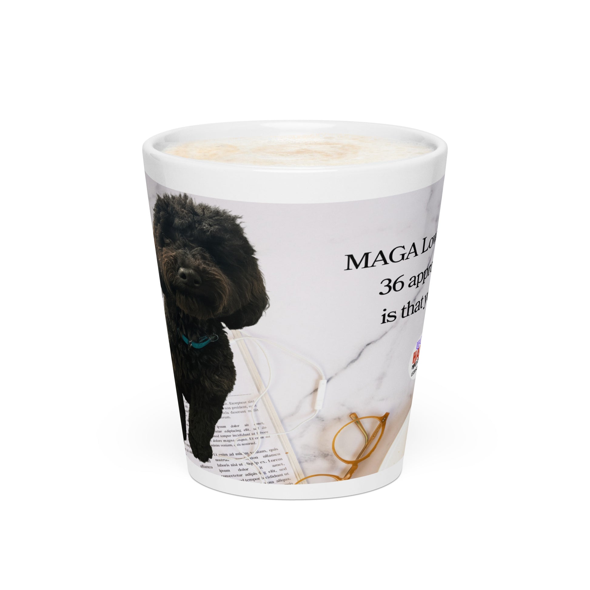 White glossy ceramic mug printed with image of a kitchen counter with a back dog sitting on a newspaper and glasses.  Political, satirical, anti-MAGA haiku is partially visible as is the text logo for leoshaiku.com