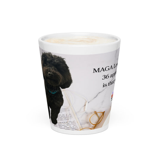 White glossy ceramic mug printed with image of a kitchen counter with a back dog sitting on a newspaper and glasses.  Political, satirical, anti-MAGA haiku is partially visible as is the text logo for leoshaiku.com