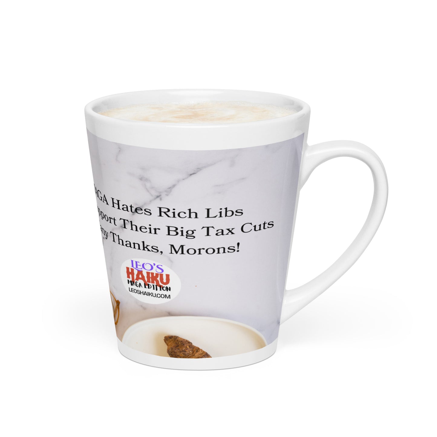 White glossy ceramic mug with a white marble background and a plate with a croissant in the foreground.  Political, satirical, anti-MAGA haiku partially shown.   Text logo for leoshaiku.com is fully displayed.