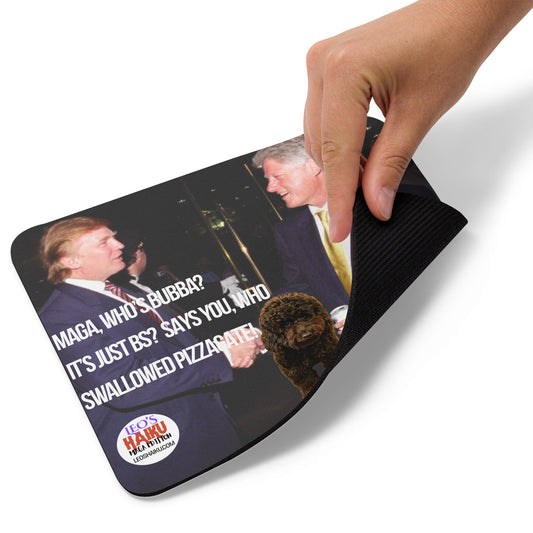 A hand picks up the lower right edge of a standard mouse pad printed with Bill Clinton and Donald Trump in suits with a dog between them, shake hands at an event.  Features political, satirical, anti-MAGA haiku and text logo for leoshaiku.com at the bottom.