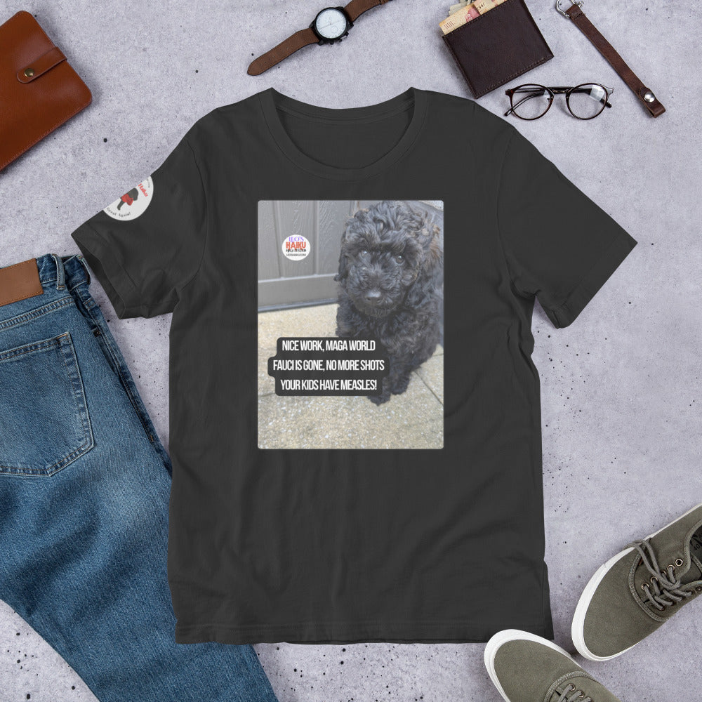 Dark gray t-shirt surrounded by items that make an outfit - shoes, jeans, watch, wallet glasses, bracelet.  The t-shirt has the image of Leo the mini poodle and a political, satirical, anti-MAGA haiku that reads:
Nice Work, MAGA World
Fauci's Gone. No More Short
Your Kids Have Measles!
The circular text logo for leoshaiku.com is top left.