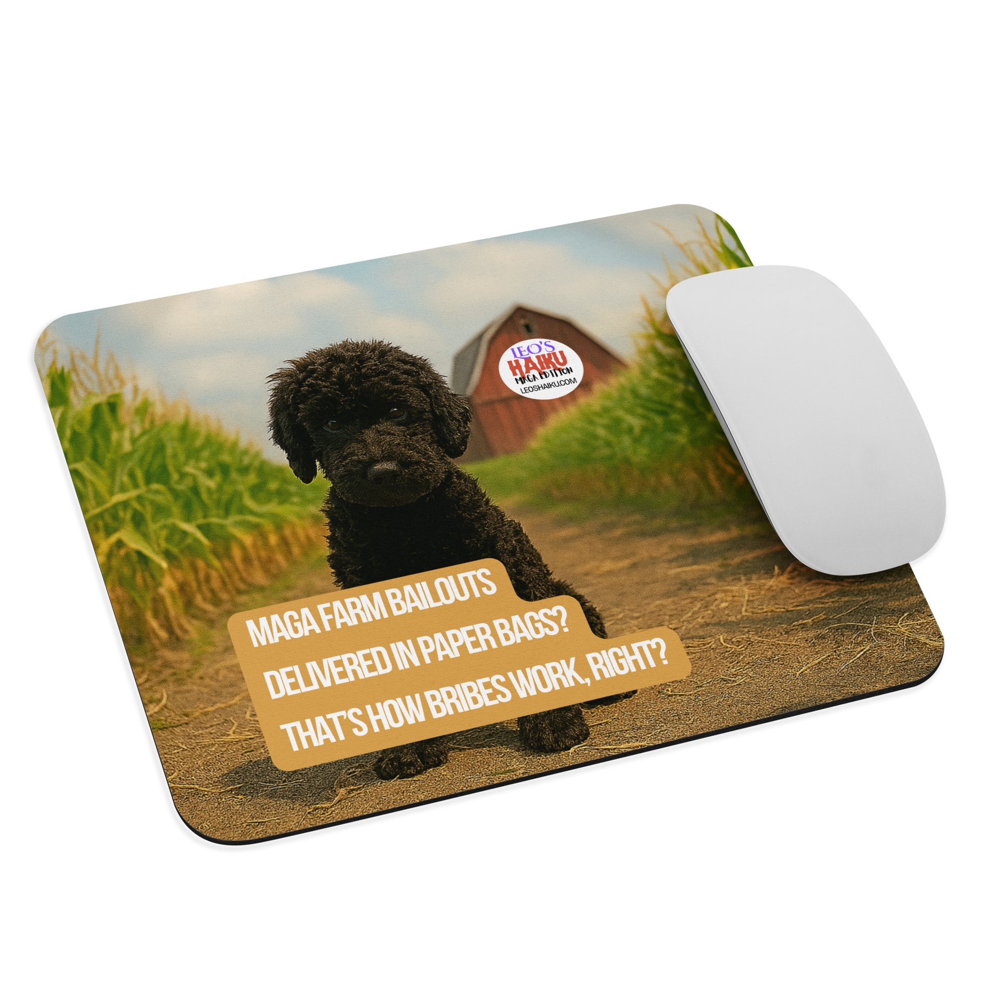 Leo the black mini poodle sits in a cornfield.  In the distance a red barn has the text logo for leoshaiku.com.  In the foreground, a political, satirical, anti-MAGA haiku says:  
MAGA Farm Bailouts
Delivered in Paper Bags?
That's How Bribes Work, Right?
A computer mouse sits at the right edge of the pad.
