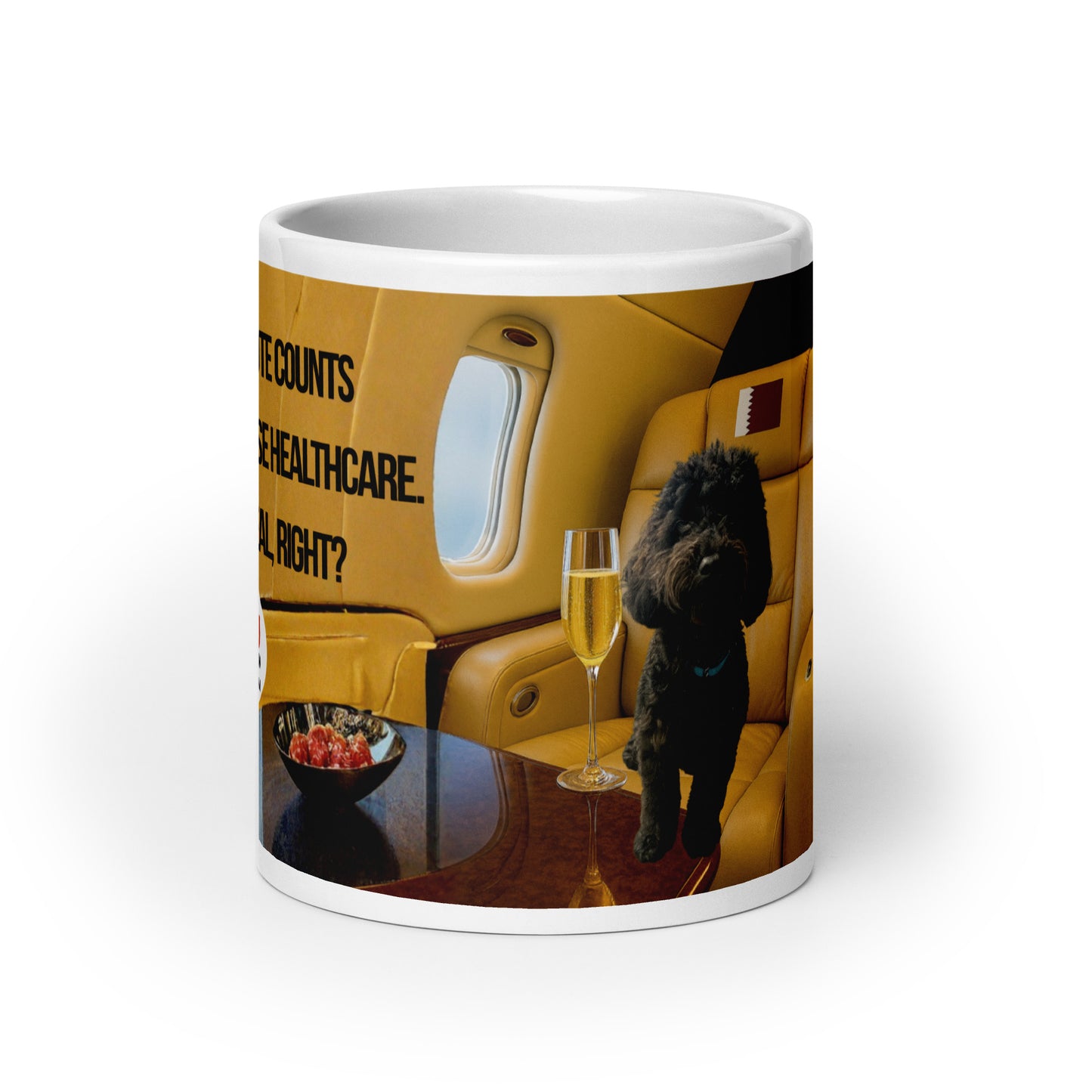 White glossy ceramic mug printed with image of a black dog in a leather plane window seat.  Tray table holds a bowl of red fruit and a glass of champagne.