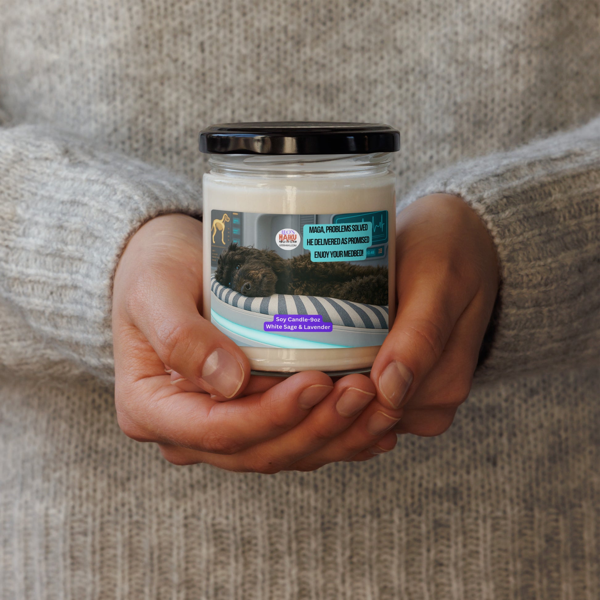 Two hands hold a candle in a glass jar w lid.  Label shows a black dog sleeping on his side on a high tech med bed.  Upper right has a political, satirical, anti-MAGA haiku that reads:
MAGA Problem Solved
He Delivered as Promised
Enjoy your Med bed
The text logo for Leoshaiku.com is to the left of the haiku.
Bottom center is a label that says Soy Candle 9oz 
White Sage & Lavender