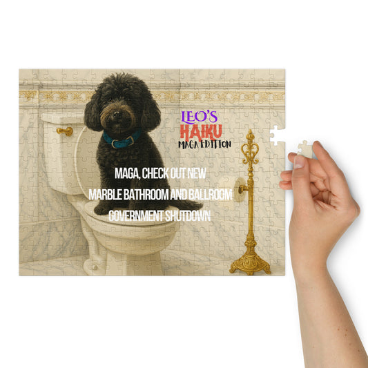 A glossy 252-piect jigsaw puzzle printed with a black dog sitting on a toilet seat in a very ornate marble and gold bathroom.  Text is political satire in haiku format; branding included.  At the right of the image, a woman's hand hold the last piece of the puzzle