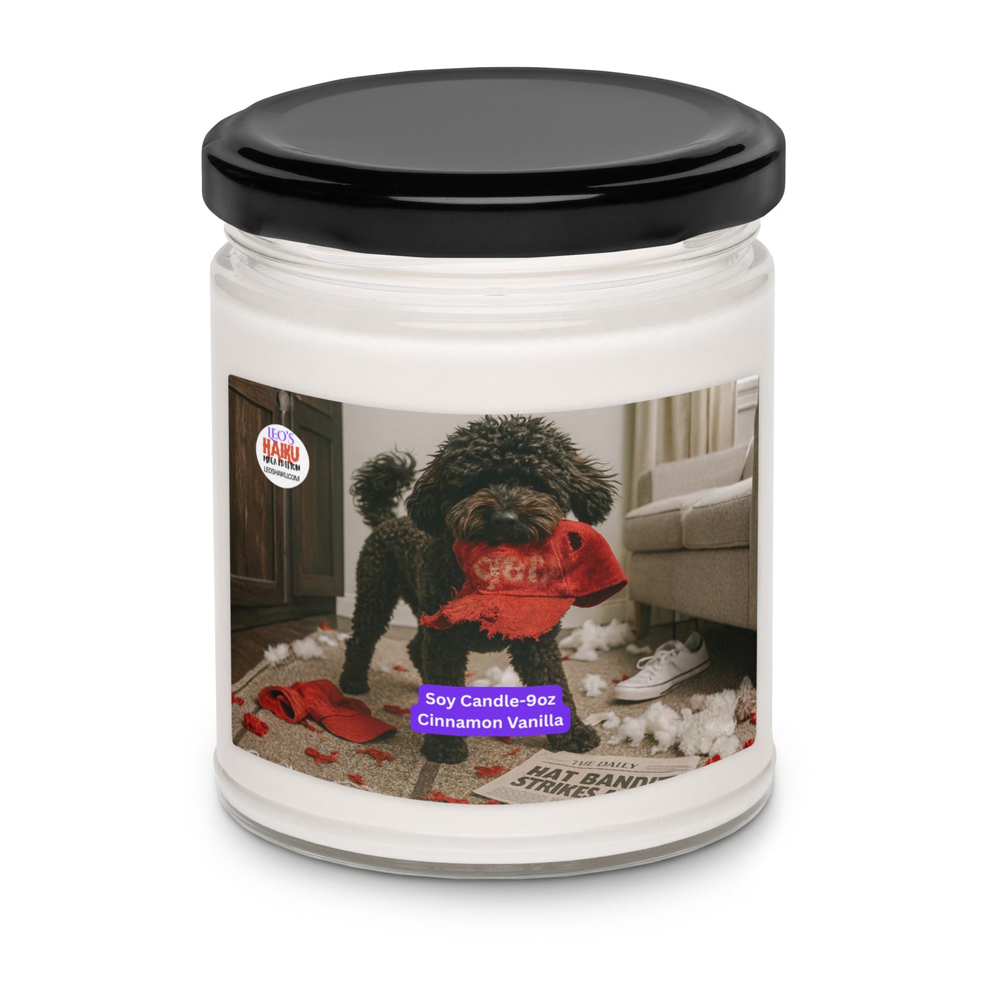 Candle in Glass with back metal lid.  Label has the picture of a small black dog in the middle of a living room where he has been chewing up things.  He has a chewed red hat in his mouth. To his left is the text logo for leoshaiku.com  Bottom center front is a white text with a purple background that says Soy Candle - 9oz Cinnamon Vanilla.