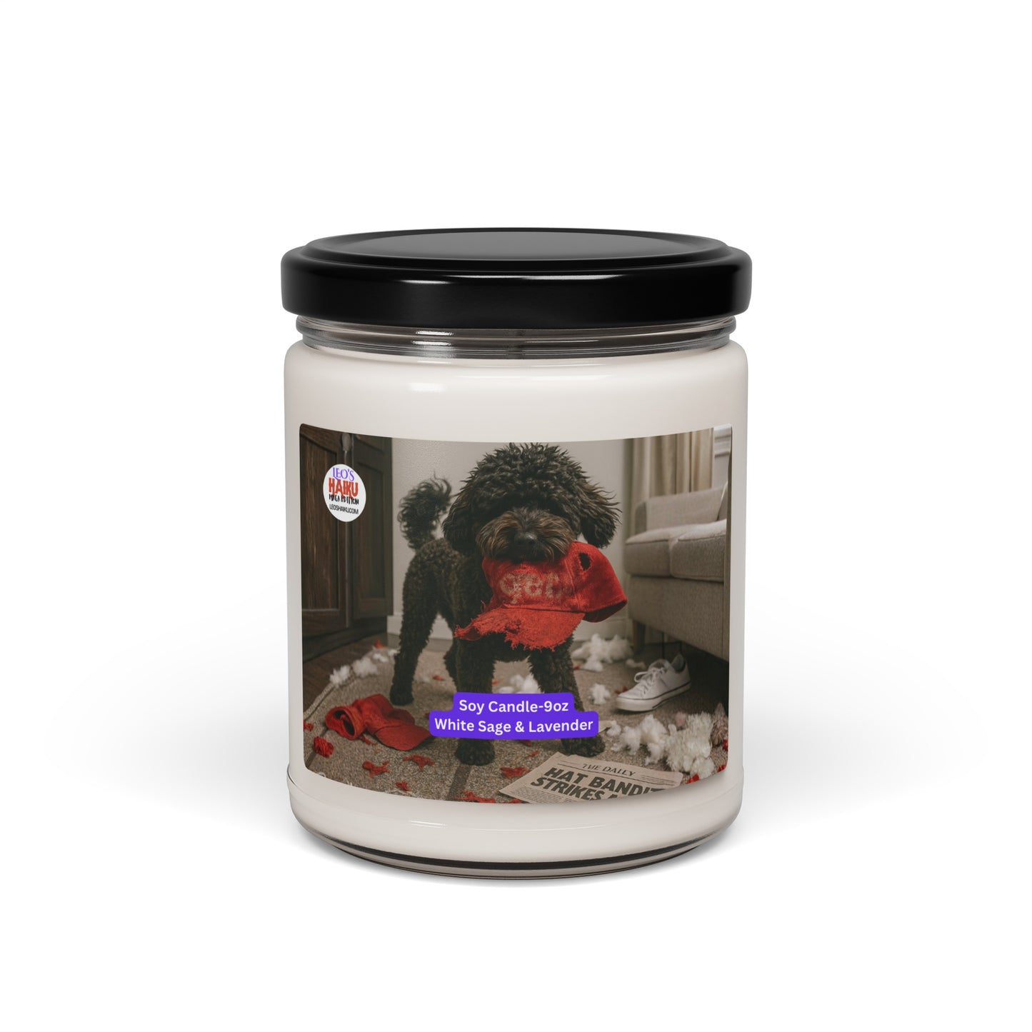 Candle in Glass jar with black metal lid.  Label has the picture of a small black dog in the middle of a living room where he has been chewing up things.  He has a chewed red hat in his mouth. To his left is the text logo for leoshaiku.com  Bottom center front is a white text with a purple background that says Soy Candle - 9oz White Sage & Lavender
