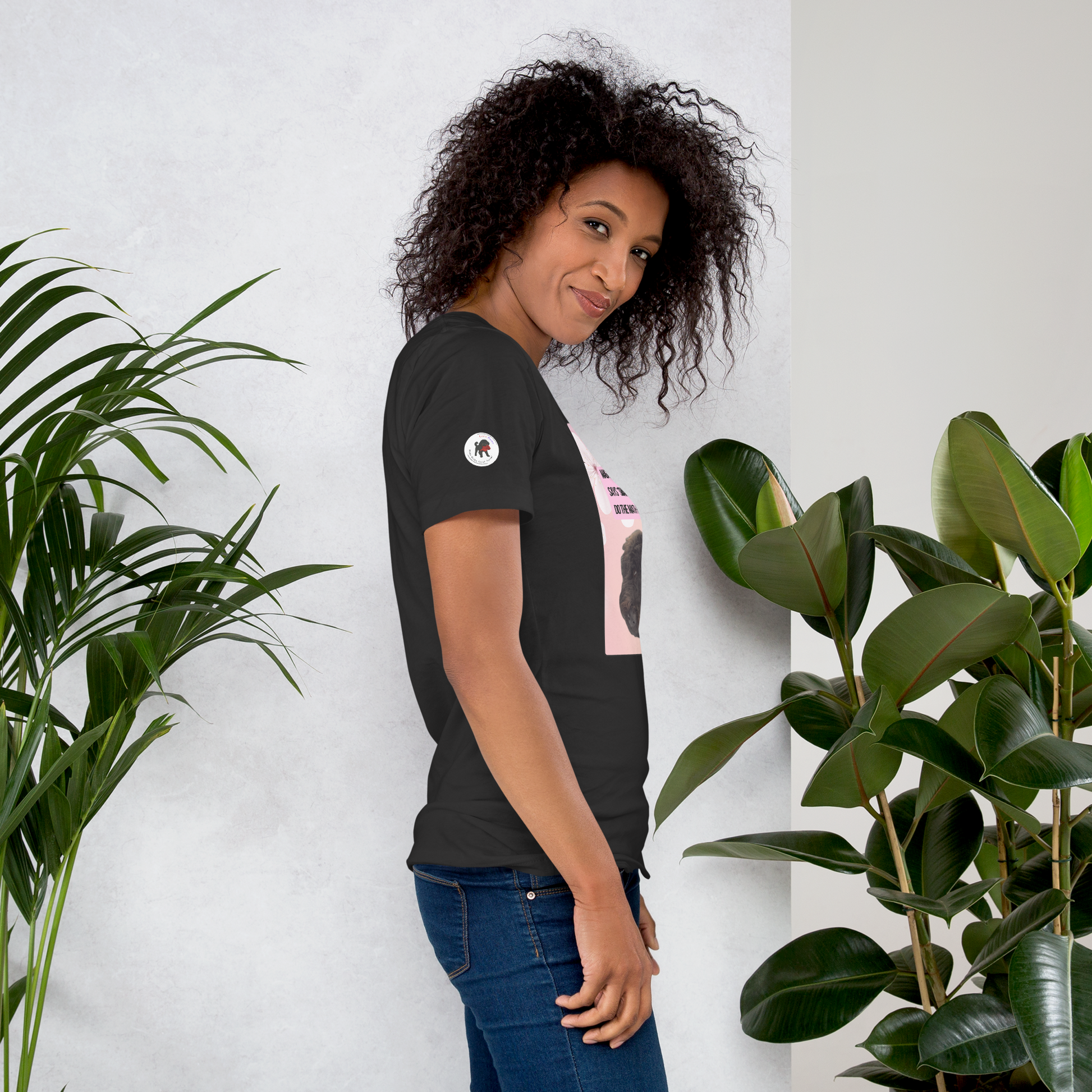 Young woman wearing a grey t-shirt, facing right.  On the right sleeve is the logo for LEOSHAIKU.COM