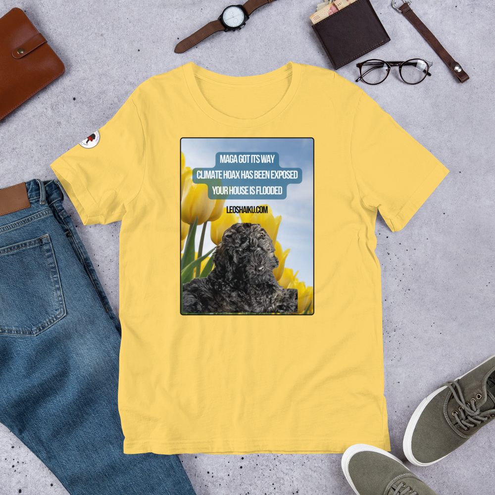 Yellow t-shirt surrounding by jeans, shoes, glasses, watch.  T-shirt is printed with the image of a black dog in a field of yellow tulips.  A political, satirical, anti-MAGA haiku reads:
MAGA Got Its Way
Climate Hoas Has Been Exposed
Your House is Flooded!
Centered below it reads Leoshaiku.com