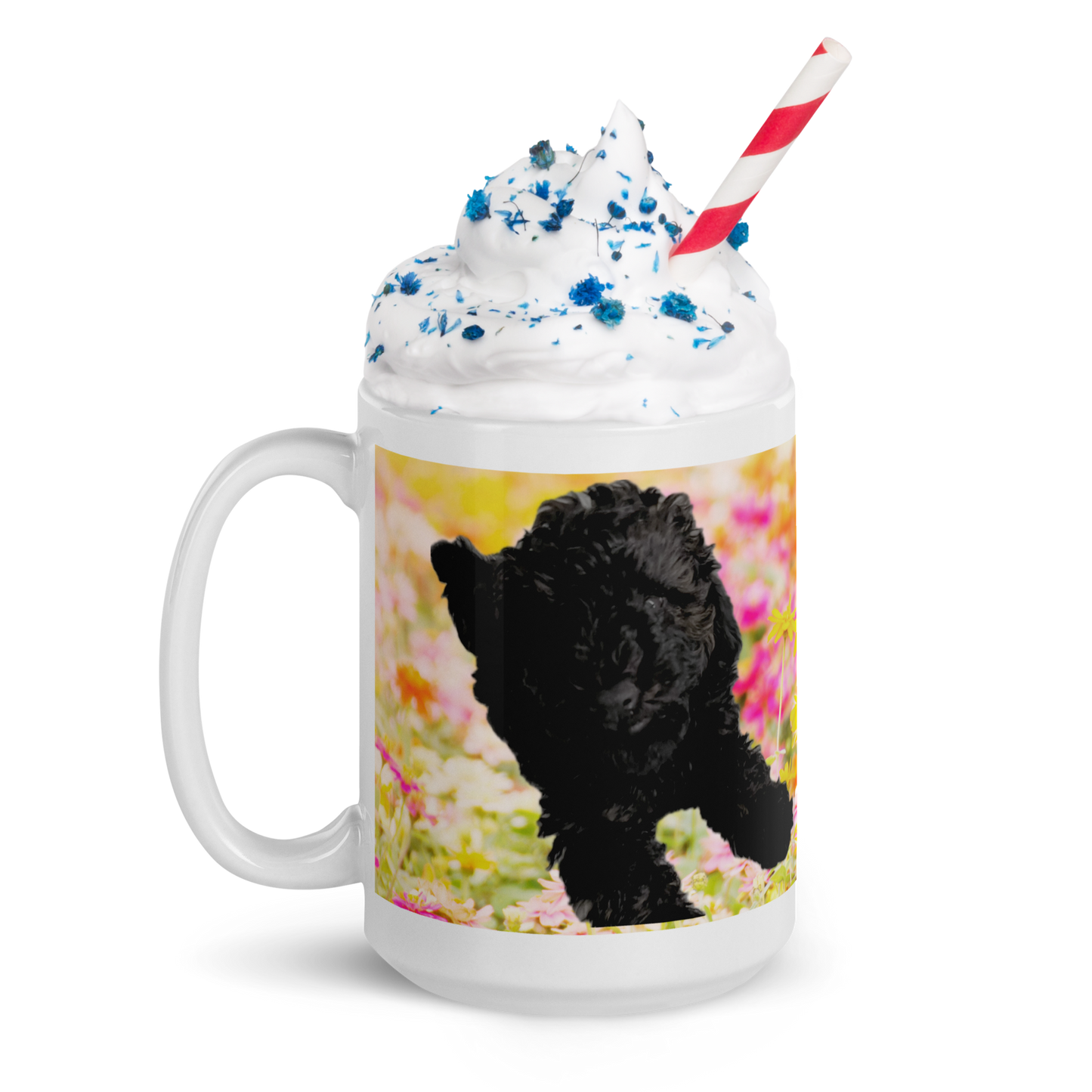 15 oz white ceramic mug, handle on the left.  Printed with bright pink and yellow flowers and a poodle.  Mug contains whip cream with blue sprinkles and a red and white striped straw.